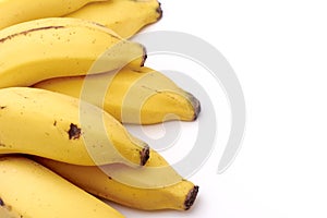 Detail of banana bunch on white background.