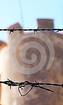 Detail of barbed wire fence next to the castle of Llorens del Penedes, Tarragona photo