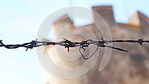 Detail of barbed wire fence next to the castle of Llorens del Penedes, Tarragona photo