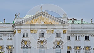 Detail of a Baroque palace with golden scultpures in Vienna photo
