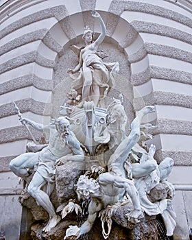 Baroque fountain with mythological sculptures in Vienna photo