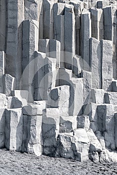 Detail of basalt columns at the base of Reynisfjall cliff in the Reynisfjara beach in southern Iceland