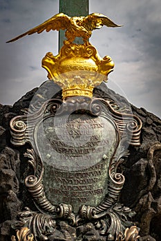 Detail of the base of the crucifixion statue of Christ on Charles bridge, Prague, Czech Republic