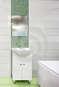 Detail of the bathroom interior with white sink and ceramic tiles