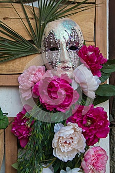 Detail of bautiful carnival mask with flowers