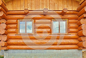 Detail of beams in cabin wall. Painted wood with fungicide paint and wooden window photo