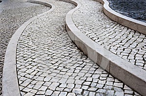 Detail of the beautiful Portuguese pavement calÃÂ§ada portuguesa in the city of Lisbon photo