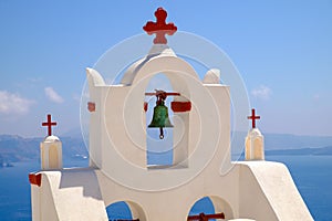 Detail of bell and crosses on traditional cycladic church, Santorini