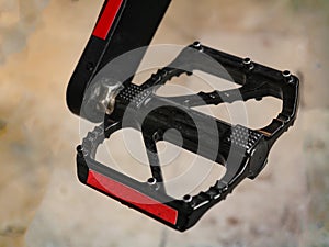 detail of bicycle pedal black and red color, bicycle pedal concept