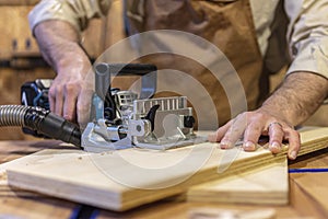 Detail of biscuit jointer at work photo