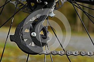 Detail from black bike, a chain tensioner photo