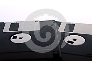 Black floppy disks isolated on white background back side