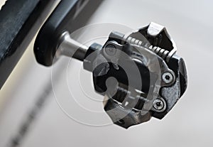 Detail of a black and gray SPD mountain bike pedal