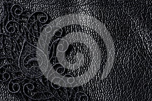 Detail of black lace on leather