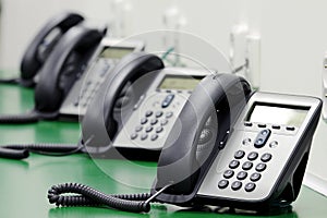 Detail of black phones in call center