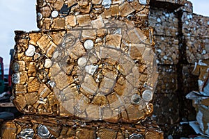 Detail of a block of rusty compacted cans