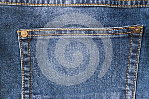 Detail of blue jeans pocket close up