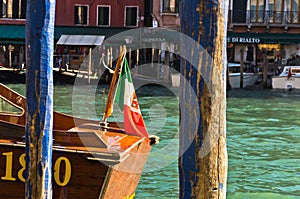 Detail of a boat with Italian flag at Grand canal in Venice