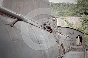 Detail of the boiler and walkway side of a steam locomotive FS 940 restored and exhibited in the heart of Garfagnana.