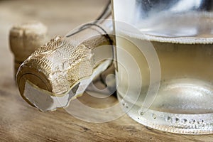 Detail of a bottle of bubbly white wine