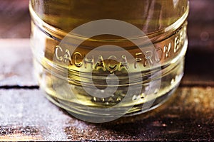 Detail of a bottle of cachaÃÂ§a, a typical Brazilian drink. Brazilian product for export, distilled drink known as aguardente or photo