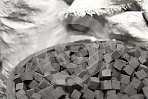 Detail of the bowl of charcoal cubes for hookah photo