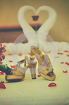 Detail of bridal shoes with decorations.