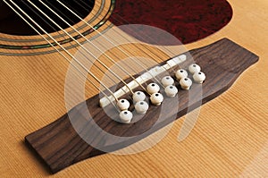 Detail of the bridge of a 12-string guitar