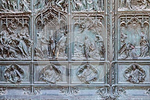 Detail of bronze door of Milan cathedral, Italy