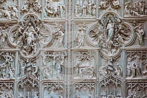 Detail of bronze door of Milan cathedral, Italy