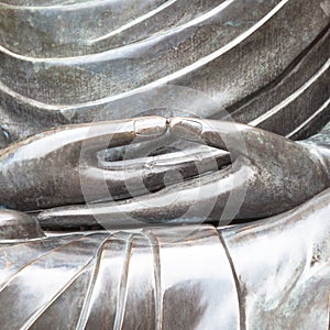 Detail of Buddha statue with Dhyana hand position, the gesture o photo