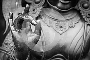 Detail of Buddha statue with Karana mudra hand position