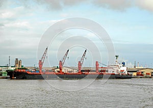detail of bulk carrier ship in abidjan harbour photo