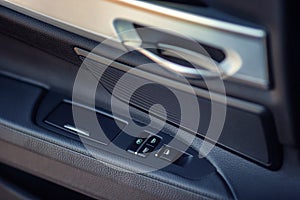 Detail of buttons controlling the windows in a car