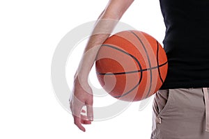 Detail of casual man holding a basketball ball