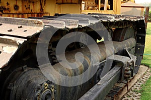 Detail of caterpillar track in construction site with dust - instant vintage square photo