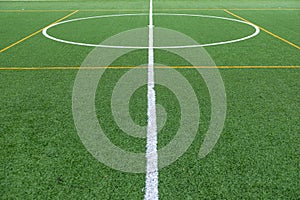 Detail of the center of an artificial grass 7-a-side football field