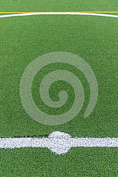 Detail of the center of an artificial grass 7-a-side football field