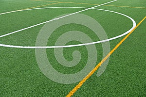 Detail of the center of an artificial grass 7-a-side football field