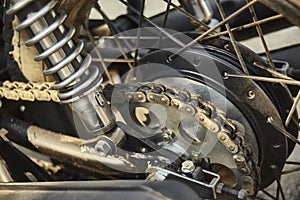 Detail of the chained transmission of a vintage motorcycle.
