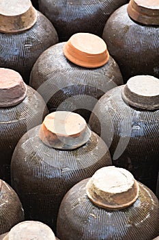 Traditional Chinese rice wine containers, the Sima Liquor Distillery, Gubei WaterTown waterways with gondalas photo