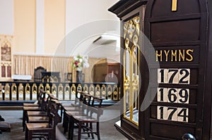 Detail of christian chirch with hymn numbers inside