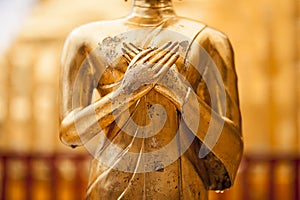 Detail and close up Golden Buddha statue close-up