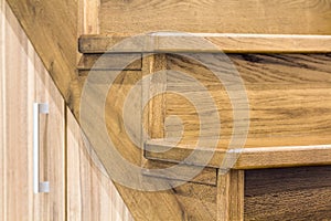 Detail close-up image of wooden oak stairs in house interior