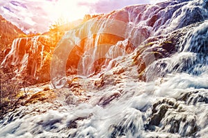 Detail and close up of Waterfall in sunlight