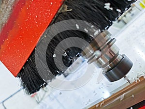 Detail of a CNC machine drill cutting through PVC