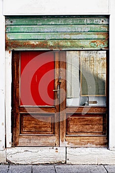 Detail of a colored door with damper in Venice