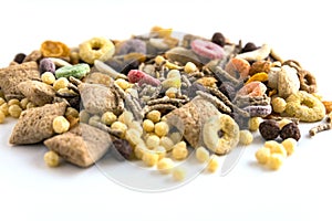 Detail of colorful cereals on white background, with blur