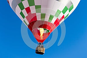 Detail colorful hot air balloon in flight flame propane