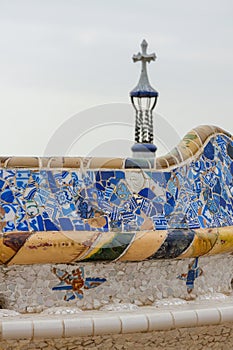 Detail of colorful mosaic work on the main terrace of Park Guell. Barcelona of Spain